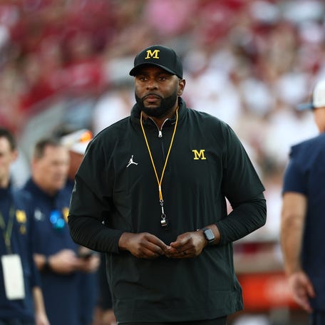 Sep 6, 2025; Norman, Oklahoma, USA; Michigan Wolverines head coach Sherrone Moore stands on the sideline prior to a game against the Oklahoma Sooners at Gaylord Family-Oklahoma Memorial Stadium. Mandatory Credit: Kevin Jairaj-Imagn Images