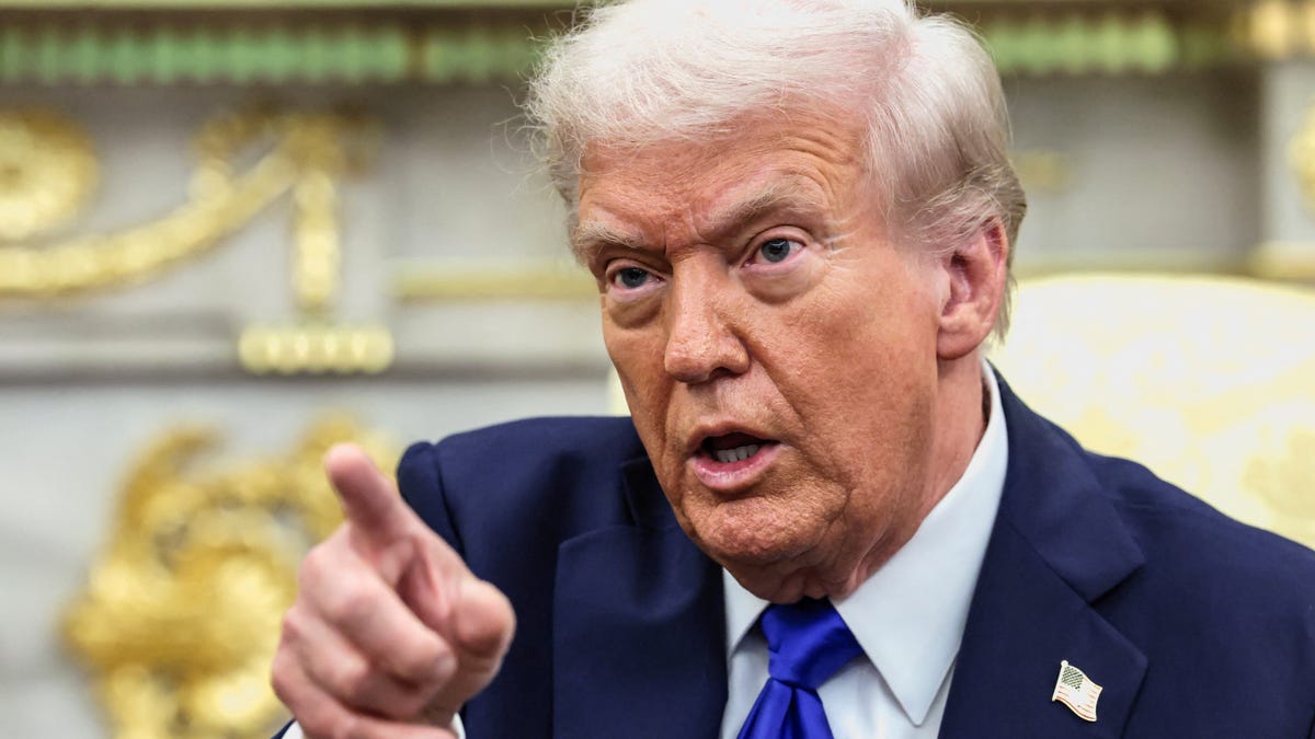 President Donald Trump points a finger during a meeting with Canada's Prime Minister Mark Carney (not pictured) in the Oval Office at the White House in Washington, D.C., U.S., October 7, 2025.