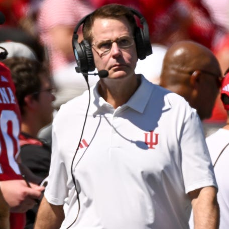 Indiana football coach Curt Cignetti walks along the sideline during his team's game against Old Dominion at Memorial Stadium.