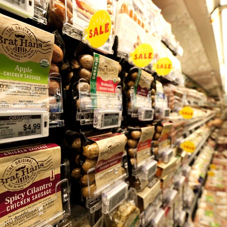 Prices of packaged sausages are displayed on digital price tags at a 365 by Whole Foods Market grocery store ahead of its opening day in Los Angeles, U.S., May 24, 2016. REUTERS/Mario Anzuoni
