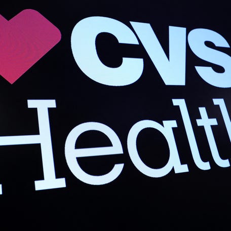 A screen displays the logo and trading information for CVS Health on the floor at the New York Stock Exchange (NYSE) in New York City, U.S., December 6, 2023.