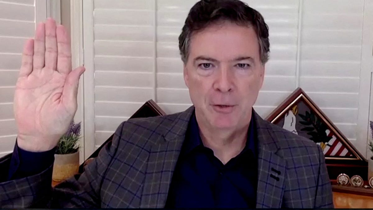 Former FBI Director James Comey is seen in a frame grab from a video feed as he is sworn in remotely from his home during a Senate Judiciary Committee hearing in Washington on Sept. 30, 2020.