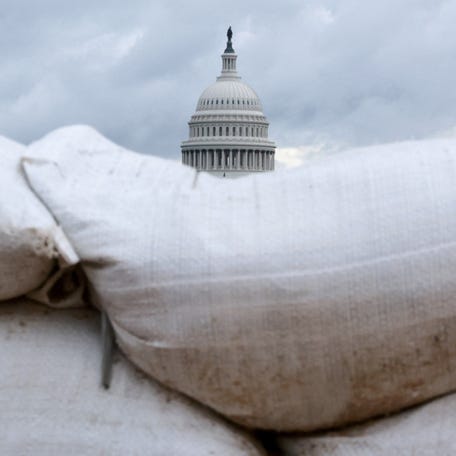 The U.S. Capitol behind construction sandbags in Washington, D.C., on Oct. 8, 2025, the eighth day of the federal government shutdown.