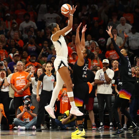 Aces center A'ja Wilson (22) makes a makes the game winning shot against Phoenix Mercury forward Alyssa Thomas (25).