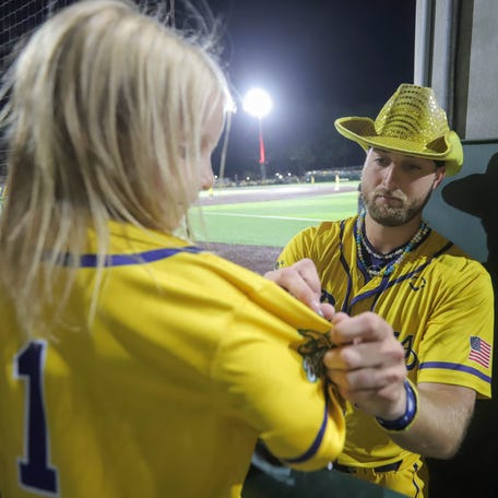 Savannah Bananas pitcher Kyle Luigs autographs a jersey for a fan during the first game of the Banana Ball Championship series on Thursday, Oct. 2, 2025 at Historic Grayson Stadium.