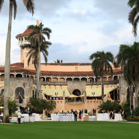 Guests congregate on a patio at Mar-a-Lago during U.S. President Donald Trump's stay, in Palm Beach, Florida, U.S., February 18, 2025.