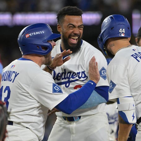 Max Muncy, Teoscar Hernandez and Andy Pages celebrate the Dodgers' Game 4 win.