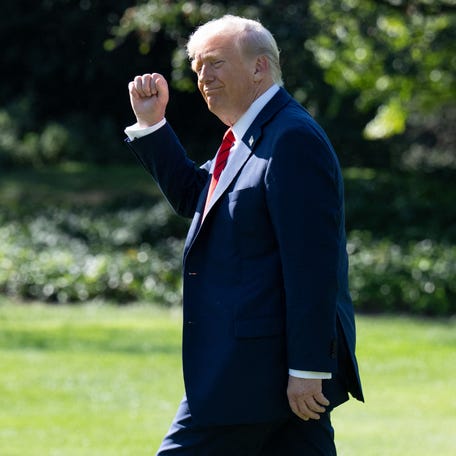 President Donald Trump gestures as he walks to Marine One on the South Lawn of the White House in Washington, DC, on October 10, 2025, on his way to Walter Reed National Military Medical Center to receive a medical checkup.