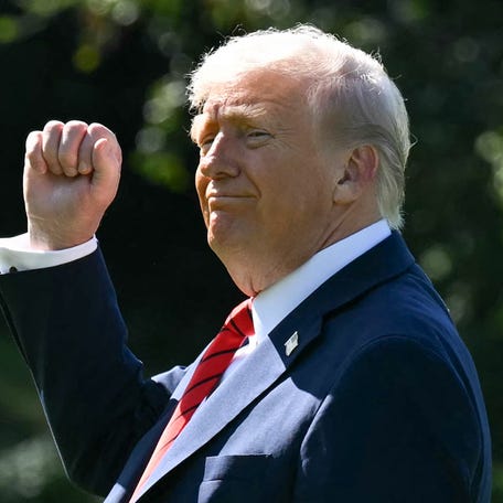 President Donald Trump gestures as he walks to Marine One on the South Lawn of the White House in Washington, DC, on October 10, 2025, on his way to Walter Reed National Military Medical Center to receive a medical checkup.
