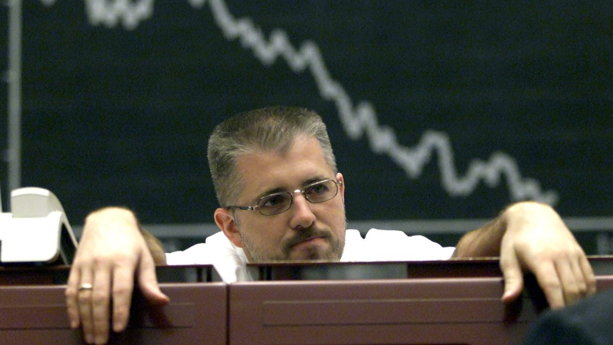 FILE PHOTO: A broker is seen under the board of the DAX (German stock market index) at Frankfurt's stock exchange September 10, 2001./File Photo