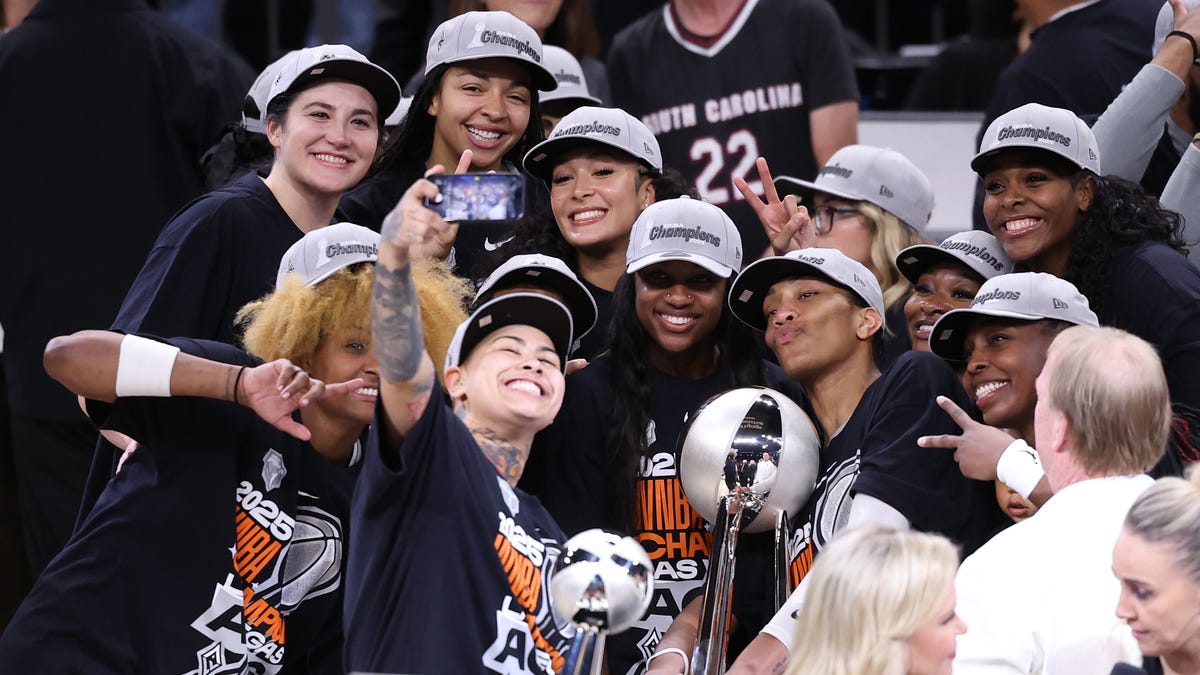 The Las Vegas Aces celebrate with the championship trophy after winning the 2025 WNBA championship against the Phoenix Mercury on Oct. 10, 2025.