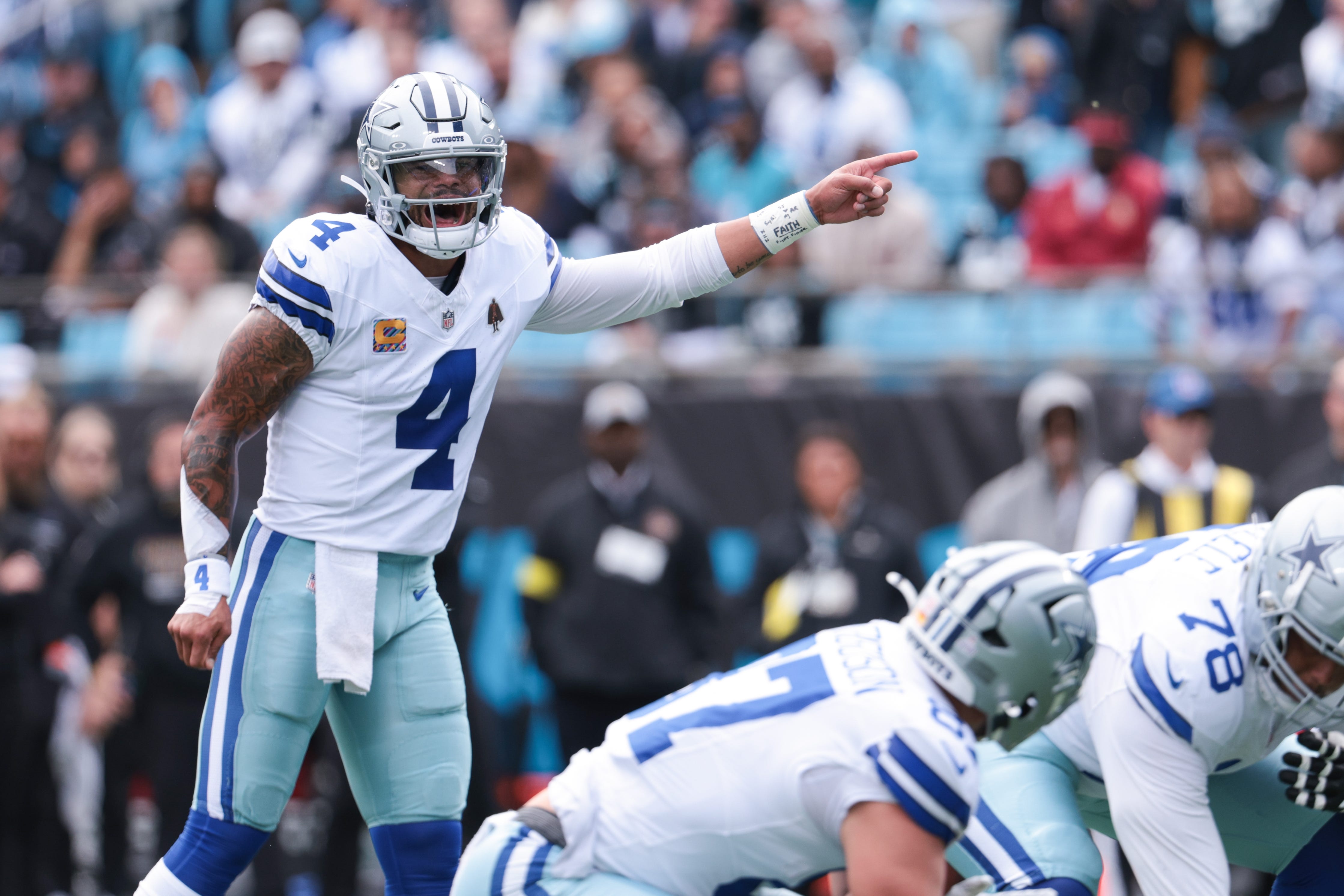 Oct 12, 2025; Charlotte, North Carolina, USA; Dallas Cowboys quarterback Dak Prescott (4) yells before the snap during the first quarter against the Carolina Panthers at Bank of America Stadium. Mandatory Credit: Scott Kinser-Imagn Images