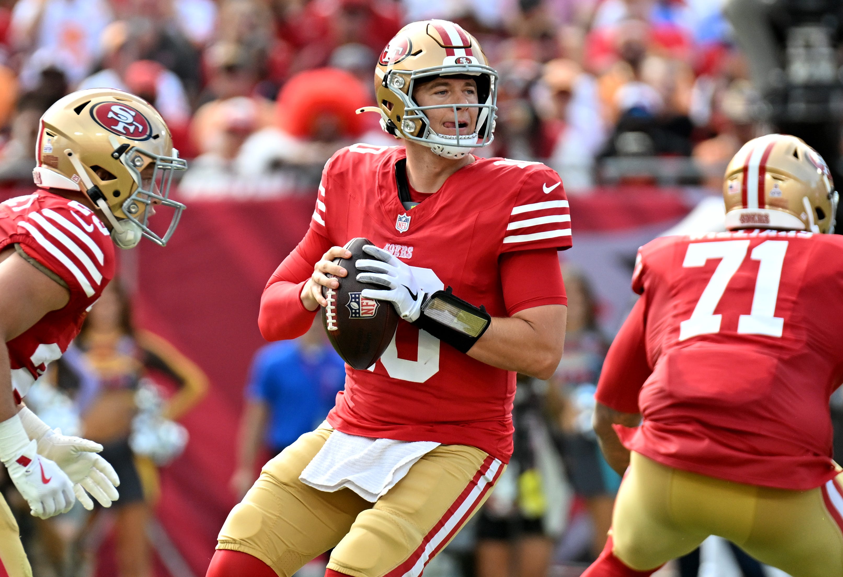 Oct 12, 2025; Tampa, Florida, USA; San Francisco 49ers quarterback Mac Jones (10) looks to throw downfield during the first quarter against the Tampa Bay Buccaneers at Raymond James Stadium. Mandatory Credit: Jonathan Dyer-Imagn Images