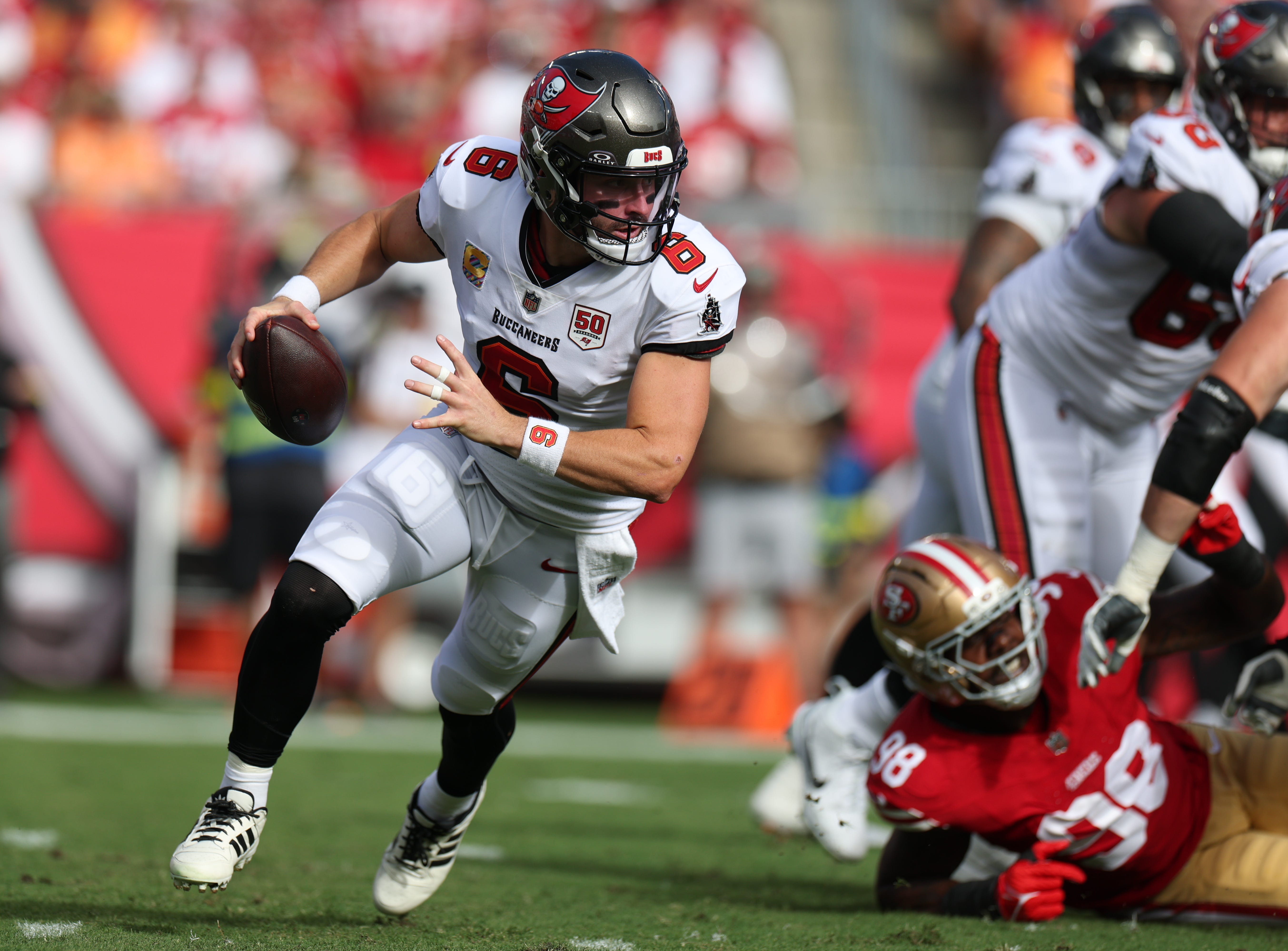 Oct 12, 2025; Tampa, Florida, USA; Tampa Bay Buccaneers quarterback Baker Mayfield (6) runs in the pocket during the first quarter against the San Francisco 49ers at Raymond James Stadium. Mandatory Credit: Nathan Ray Seebeck-Imagn Images