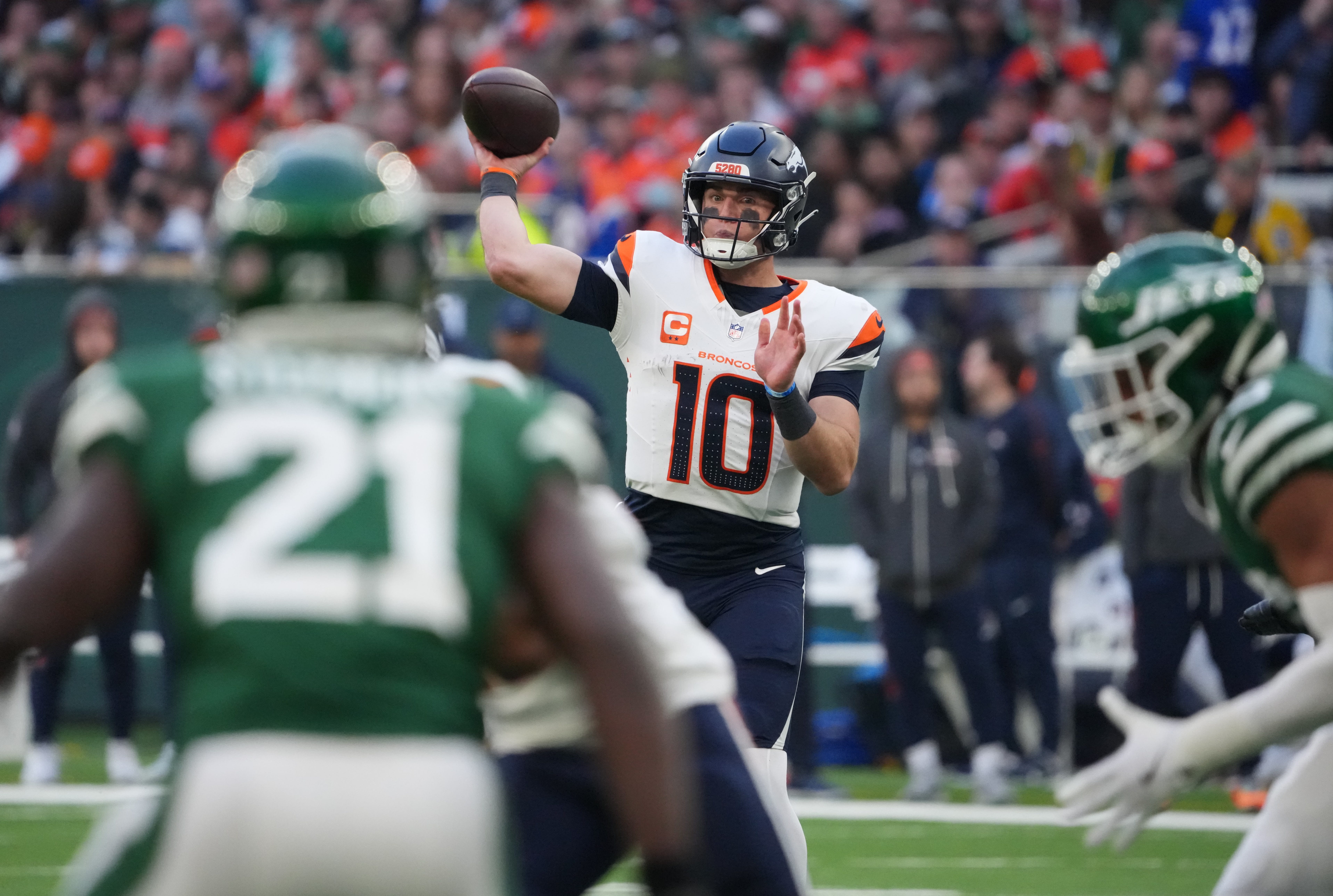 Oct 12, 2025; Tottenham, United Kingdom; Denver Broncos quarterback Bo Nix (10) throws a pass against the New York Jets during an NFL International Series game at Tottenham Hotspur Stadium. Mandatory Credit: Kirby Lee-Imagn Images