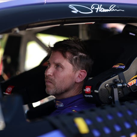 Denny Hamlin looks on in his No. 11 Joe Gibbs Racing Toyota after qualifying for the NASCAR Cup Series playoff race at Las Vegas Motor Speedway on Oct. 11, 2025.