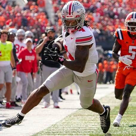 Ohio State wide receiver Jeremiah Smith (4) during his team's game against Illinois at Gies Memorial Stadium.