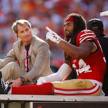 Fred Warner is carted off of the field after being injured during the first quarter against the Buccaneers.
