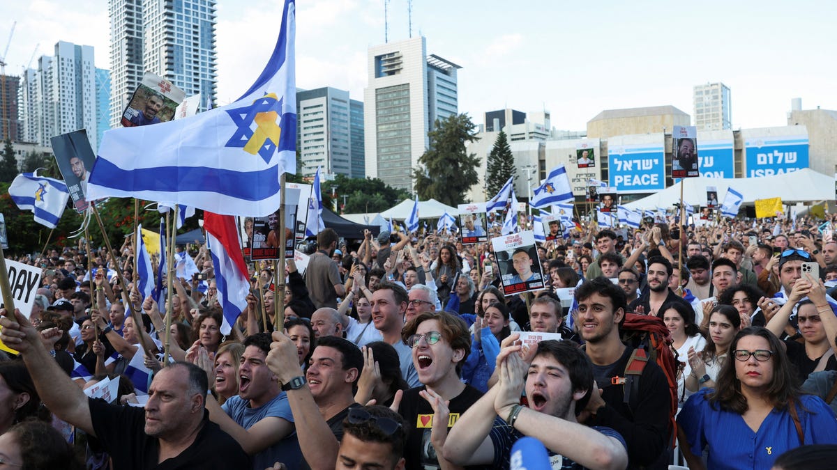 People gather at "Hostages Square" in Tel Aviv, Israel, on Oct. 13, 2025, to await the expected return of Israeli hostages, who have been held in Gaza since the deadly Oct. 7, 2023, attack by Hamas, as part of a ceasefire deal between Israel and Hamas.