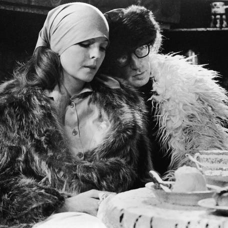 Woody Allen leans his head on the shoulder of Diane Keaton in a scene from 'Love and Death,' directed by Allen in 1975.