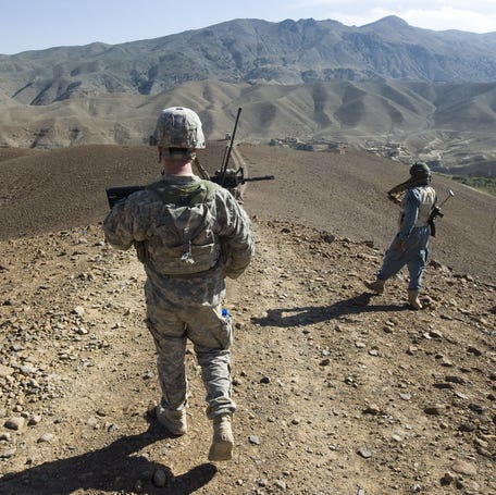 Vermont National Guard 2nd Lt. Parker Chapman heads down a path into lower Dandar Village on Thursday, September 23, 2010 to talk with residents there and get a sense of whether the area is friendly or not. After more than a month away to help bolster security near Kabul during the elections, the Taliban moved into the village. The effect was chilling. Children friendly to Chapman just a few weeks earlier threw rocks at the back of the patrol as they moved through. Others refused to take   bottled water or pens from soldiers, usually a favorite gift for kids in the village.    Afghanistan Special 12988