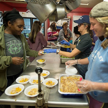 Maddy Jones/mjones@citizen-times.com  Volunteers serve a healthy, hot meal of tilapia, broccoli, rice and peach cobbler at the Steadfast House, a local ABCCM shelter for women and children who are victims of domestic violence.  Volunteers serve a healthy, hot meal of tilapia, broccoli, rice, and peach cobbler November 11, 2015 at the Steadfast House, a local ABCCM shelter for women and children who are victims of domestic violence,    Volunteers serve a meal of tilapia, broccoli, rice and peach cobbler at the Steadfast House, an Asheville-Buncombe Community Christian Ministries shelter for women and children who were formerly homeless, victims of domestic violence or have other housing needs. National fears that a tax law change would reduce charitable giving have, for the most part, not been realized at local charities like ABCCM.    Ashbrd 06 14 2017 Act 1 A006 2017 06 13 Img 635840539210890988 M 1 1 Ceimgkjb L1046583861 Img 635840539210890988 M 1 1 Ceimgkjb