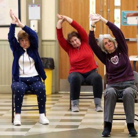 Yoga instructor Tara Scheller leads seniors in chair yoga at the James F. Galgano Senior Center in Sleepy Hollow May 25, 2023. The village provides free exercise classes to the seniors and supports activities like bingo, knitting and a monthly trip.