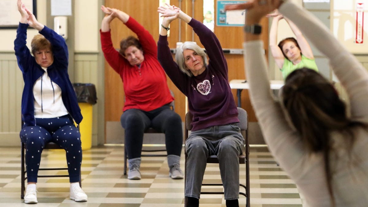 Yoga instructor Tara Scheller leads seniors in chair yoga at the James F. Galgano Senior Center in Sleepy Hollow May 25, 2023. The village provides free exercise classes to the seniors and supports activities like bingo, knitting and a monthly trip.