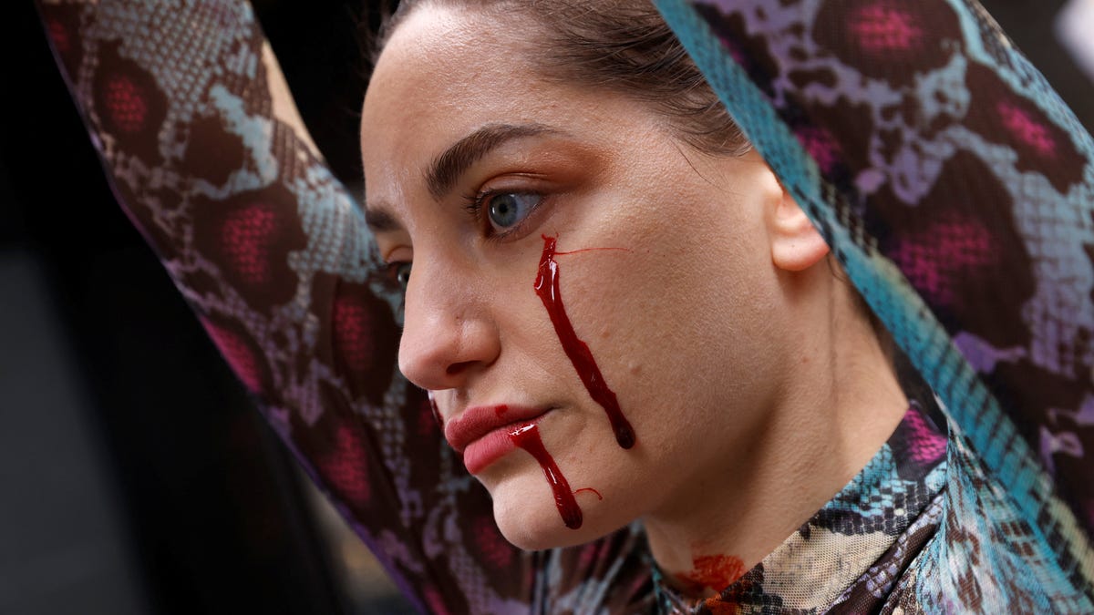 A member of the organization People for the Ethical Treatment of Animals (PETA) takes part in a protest outside the Louis Vuitton store in Manhattan, New York City, January 20, 2022.