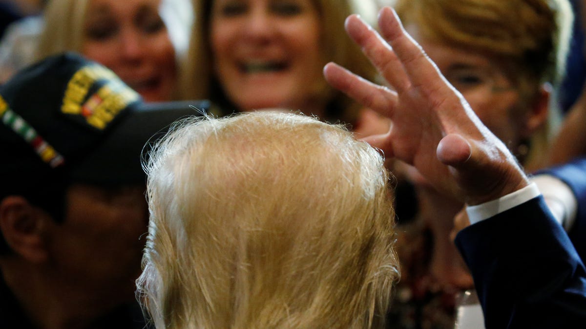 U.S. Republican presidential candidate Donald Trump talks about his hair as he works the rope line at a post Republican Convention campaign event in Cleveland, Ohio, July 22, 2016.