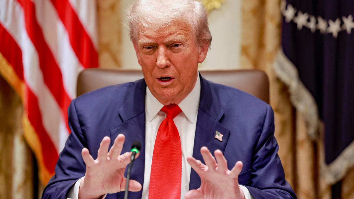 President Donald Trump gestures as he speaks during lunch with Argentina's President Javier Milei (not pictured) in the Cabinet Room at the White House in Washington, D.C., on Oct. 14, 2025.