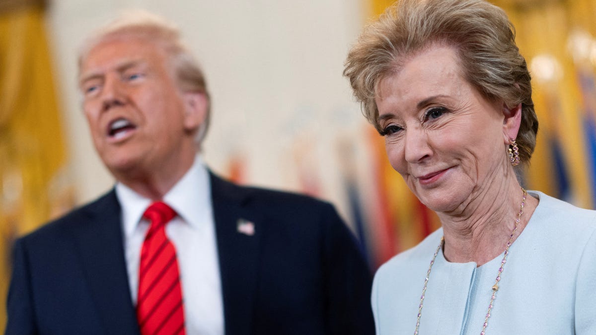 FILE PHOTO: U.S. Secretary of Education Linda McMahon smiles during the signing event for an executive order to shut down the Department of Education next to U.S. President Donald Trump, in the East Room at the White House in Washington, D.C., U.S., March 20, 2025. REUTERS/Carlos Barria/File Photo