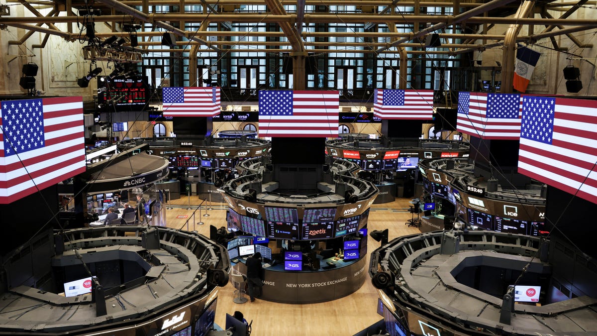 American flags are displayed on screens on the floor at the New York Stock Exchange (NYSE) in New York City, U.S., September 22, 2025.