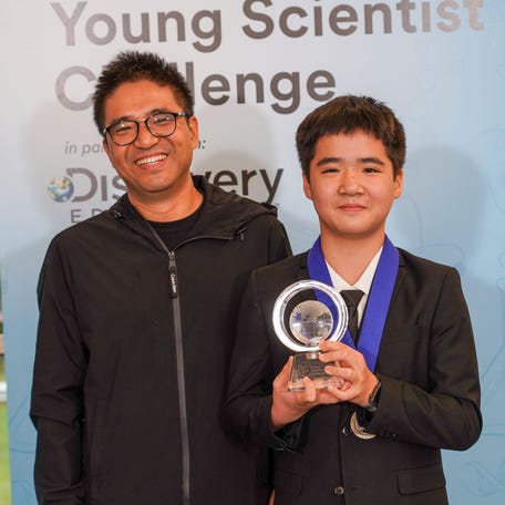 Kevin Tang and his father.