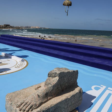 An artifact retrieved by Egyptian divers lays at Abu Qir Naval Port anticipating a visit by Sherif Fathy, Egypt's minister of tourism and antiquities, and Supreme Council of Antiquities Secretary-General Mohamed Ismail Khaled in the coastal city of Alexandria, Egypt, on August 21, 2025. \