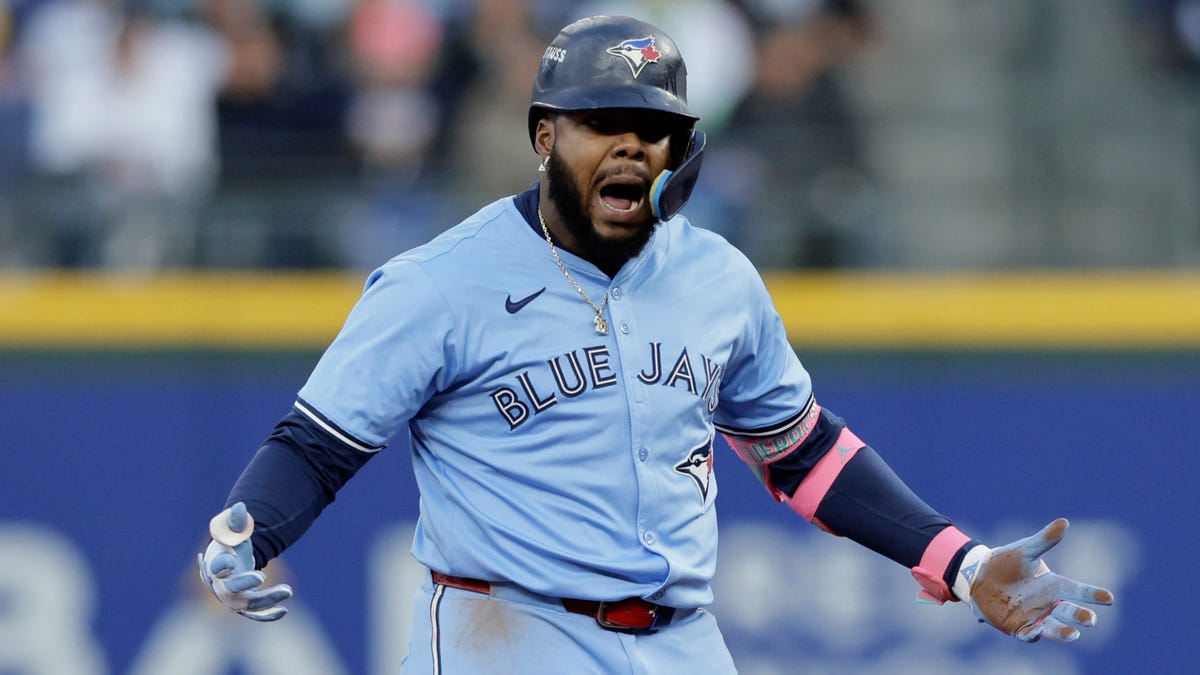 Vladimir Guerrero Jr. celebrates after his double in the third inning of Game 3.