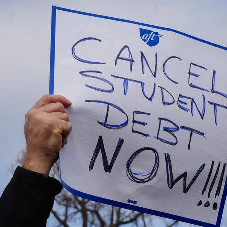 Feb 28, 2023; Washington, DC, USA; Protestors gather outside the U.S. Supreme Court ahead of the oral arguments in two cases that challenge President Joe Biden's $400 billion student loan forgiveness plan.