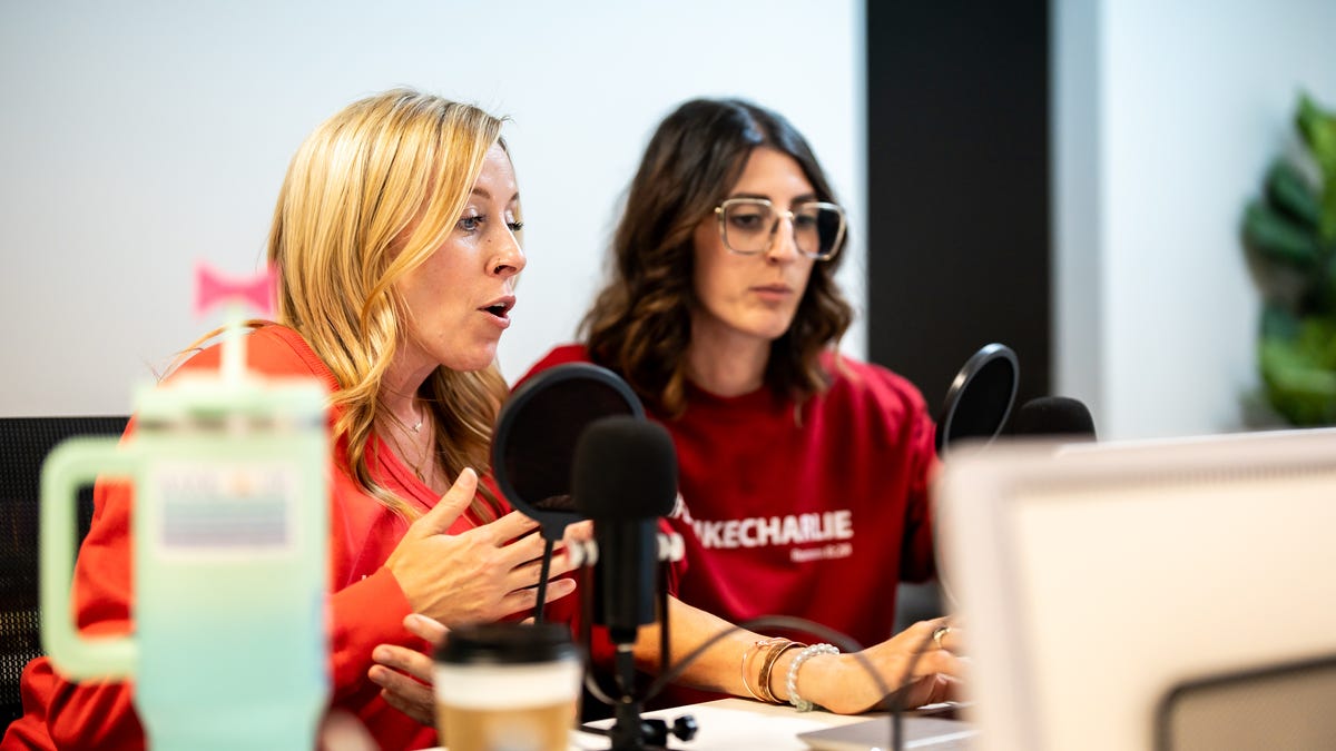 Friends Brandy Bright, left, and April LoConti interview the author of the Tuttle Twins book series during their conservative podcast, called, "Crunchy Moms Unfiltered," Oct. 14, 2025, in Willoughby, Ohio. The book series focuses primarily on teaching libertarian and economic principles from a conservative perspective.