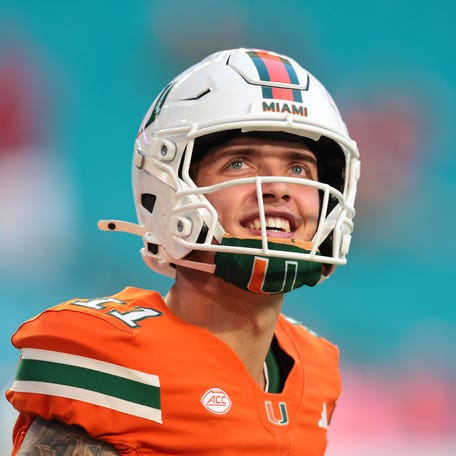 Oct 17, 2025; Miami Gardens, Florida, USA; Miami Hurricanes quarterback Carson Beck (11) looks on from the field before the game against the Louisville Cardinals at Hard Rock Stadium. Mandatory Credit: Sam Navarro-Imagn Images