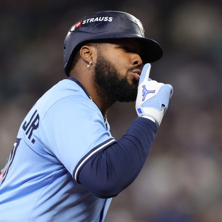 Vladimir Guerrero Jr. celebrates after his home run in the seventh inning of Game 4.