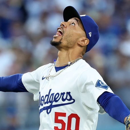 Mookie Betts celebrates an out in the ninth inning of Game 3.