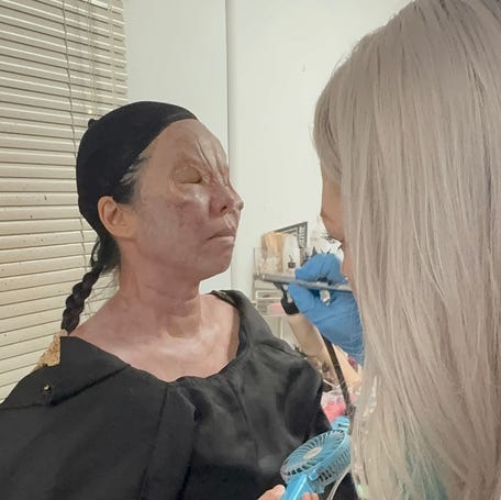 Makeup artist Dakota Rogers airbrushed fine details onto my vampire face.