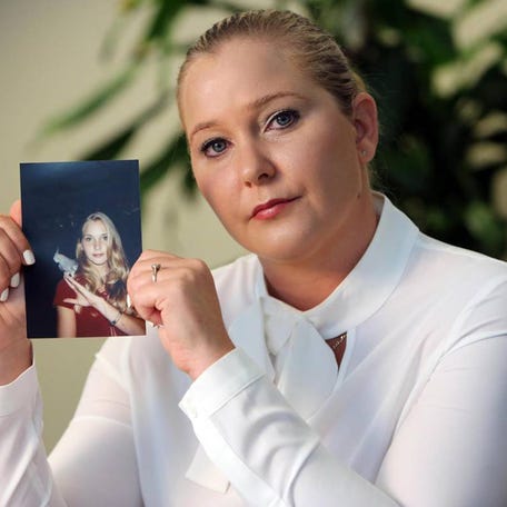 Virginia Giuffre, with a photo of herself as a teen, when she says she was abused by Jeffrey Epstein, Ghislaine Maxwell and Prince Andrew, among others.