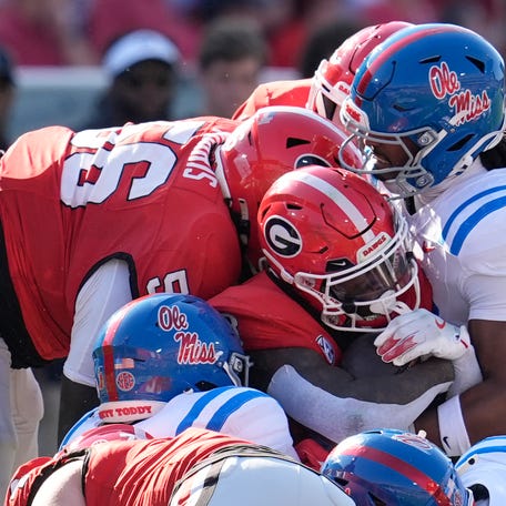 Oct 18, 2025; Athens, Georgia, USA; Georgia Bulldogs running back Nate Frazier (3) is stopped by the Mississippi Rebels defense during the first quarter of the game at Sanford Stadium. Mandatory Credit: Dale Zanine-Imagn Images