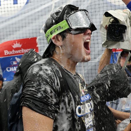 Shohei Ohtani celebrates after the Dodgers won Game 4 of the NLCS.