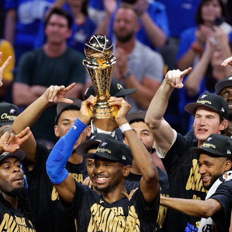 Oklahoma City Thunder guard Shai Gilgeous-Alexander (2) lifts the Larry O'Brien Championship Trophy as the Oklahoma City Thunder celebrate after winning the 2025 NBA Finals against the Indiana Pacers on Jun 22, 2025.