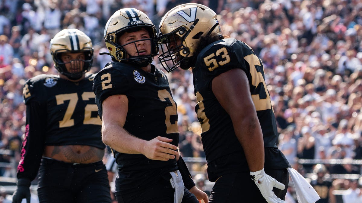 Vanderbilt quarterback Diego Pavia (2) celebrates offensive lineman Jordan White (53) during his team's game against LSU at FirstBank Stadium in Nashville, Tenn., Saturday, Oct. 18, 2025.