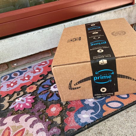 An Amazon Prime box is seen on a customer's doorstep.