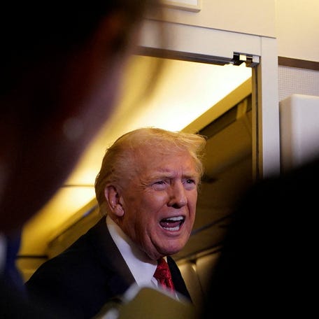 U.S. President Donald Trump speaks to members of the media as he flies from Florida to Washington, aboard Air Force One, U.S., October 19, 2025. REUTERS/Elizabeth Frantz