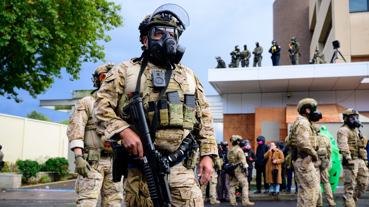 Federal agents clash with anti-I.C.E. protesters at the U.S. Immigration and Customs Enforcement building on October 12, 2025 in Portland, Oregon. An Instagram post from the WorldNakedBikeRidePortland account stated - "The emergency WNBR Portland is in response to the militarization of our peaceful city. Right now peaceful protesters are being brutalized as they do their best for our neighbors and cousins who are being kidnapped."